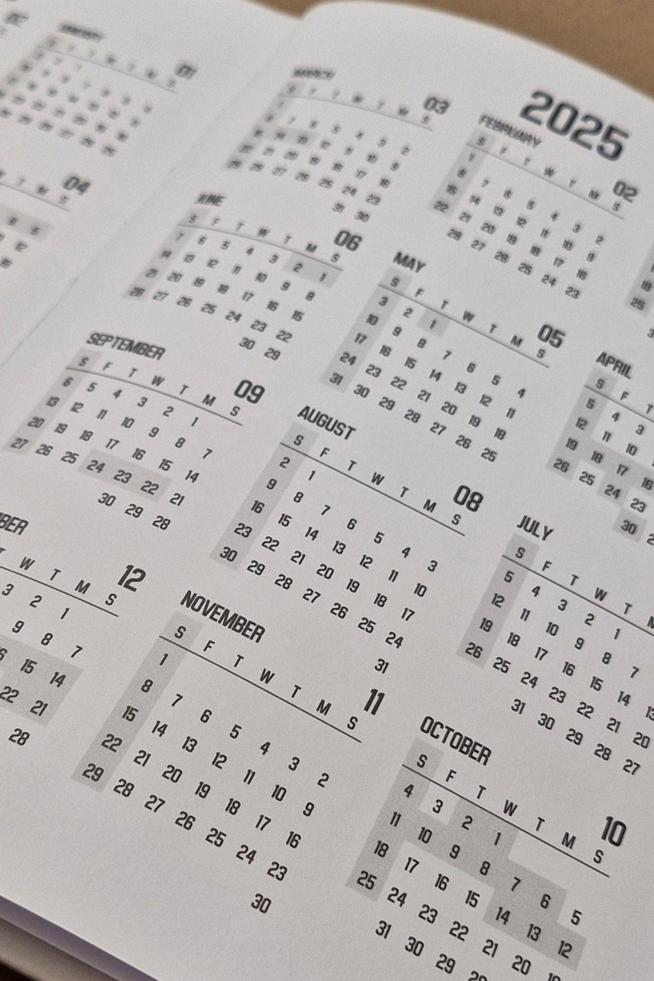 Calendar with Chinese characters on a brown surface