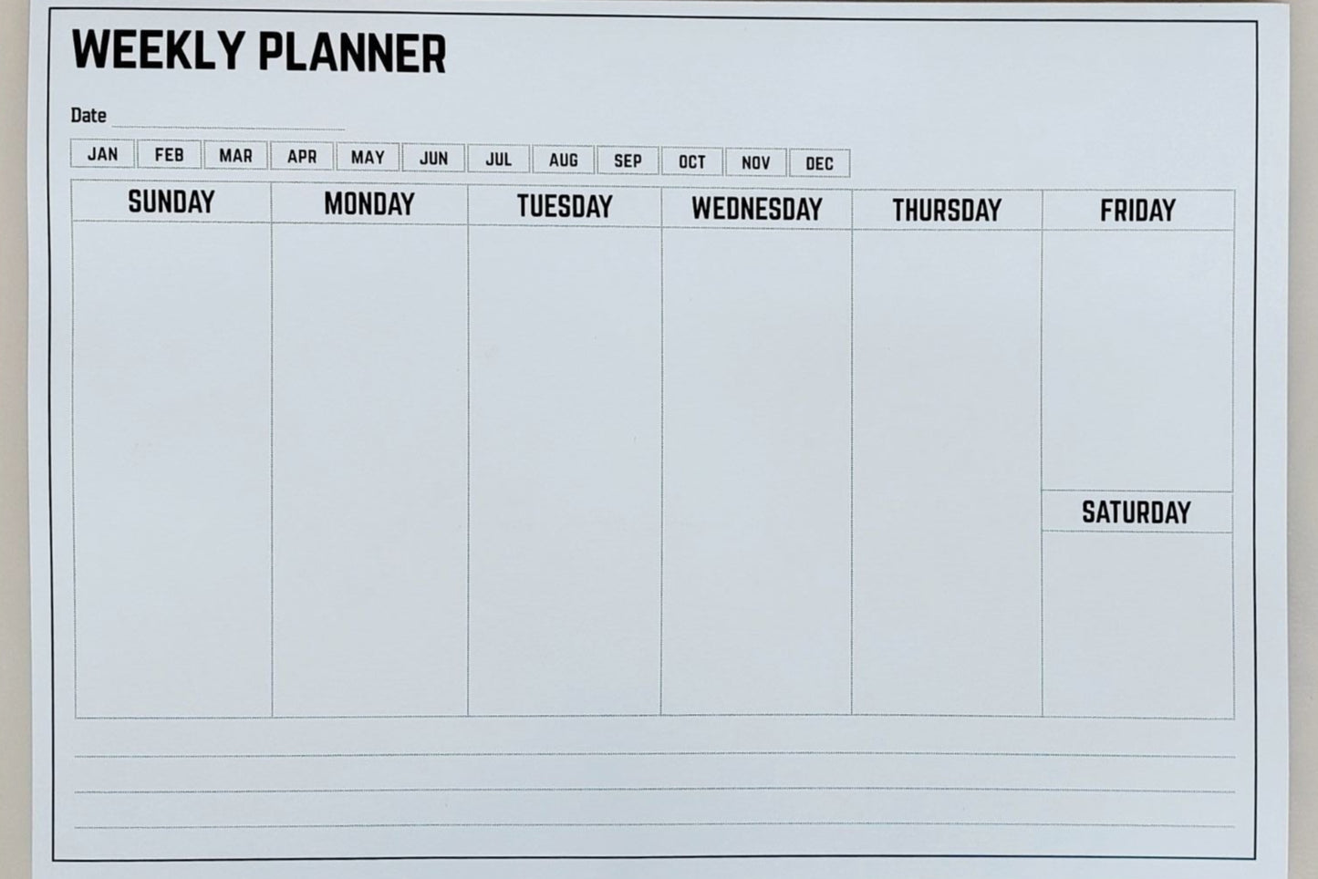 Weekly planner sheet with days of the week on a white background