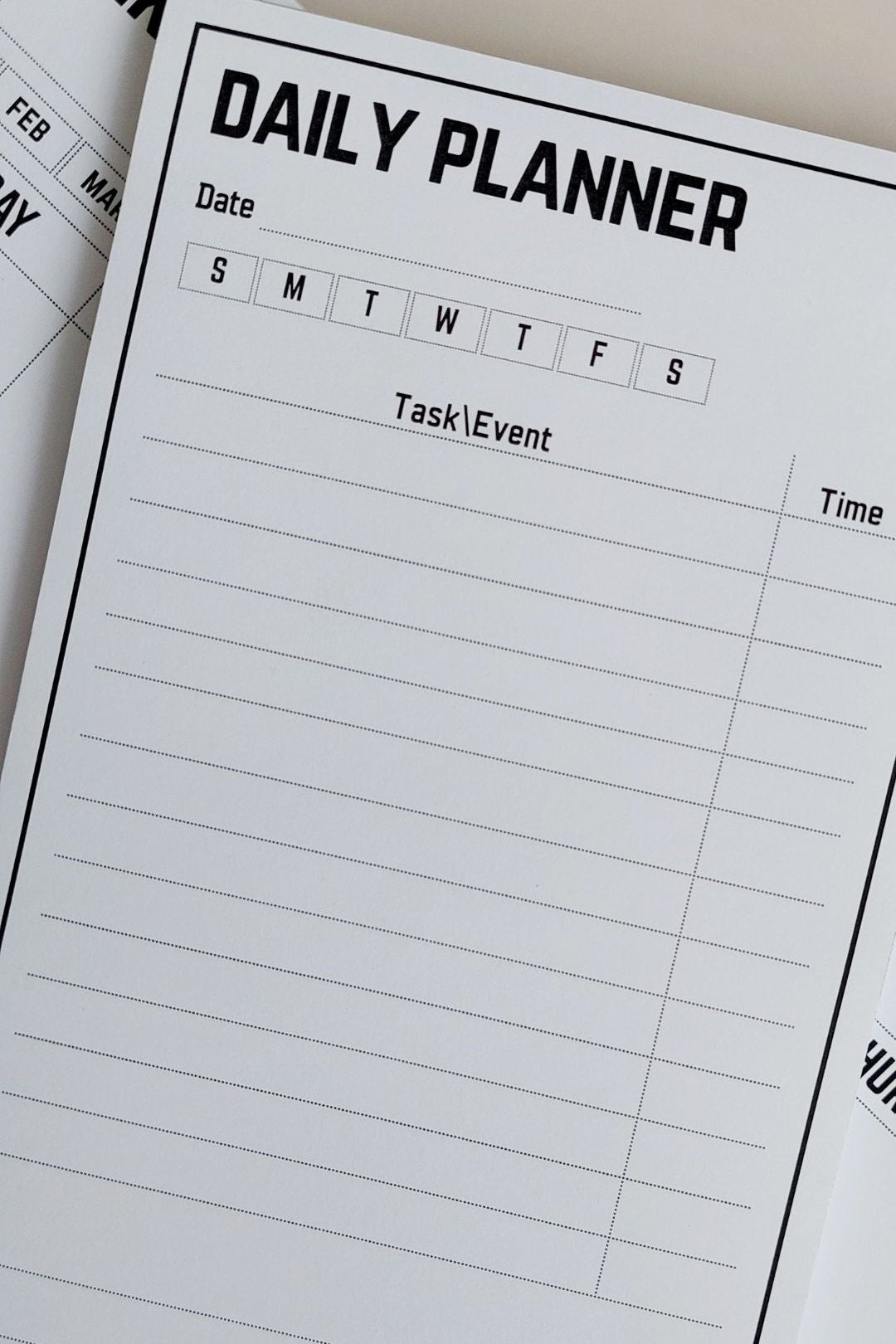 Daily planner with a clear layout for tasks and events on a white surface.