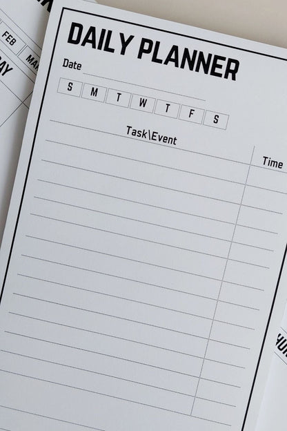 Daily planner with a clear layout for tasks and events on a white surface.