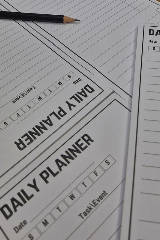 Daily planner sheet with a pencil on a wooden surface